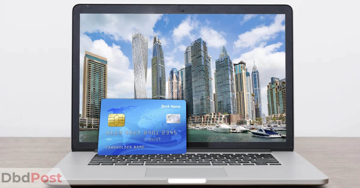Feature Image-best credit card in uae-Credit Card on laptop with dubai wallpaper
